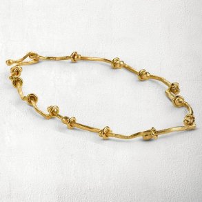 Guld armbnd med bevgelige led